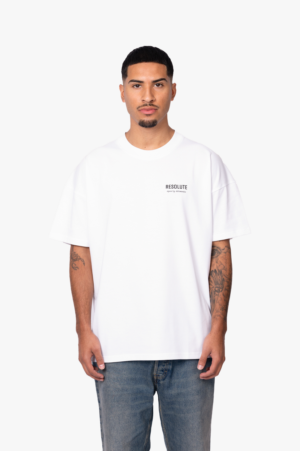 DEFINED BY DETERMINATION T-SHIRT | WHITE