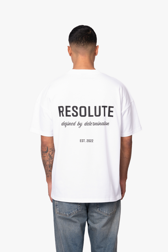 DEFINED BY DETERMINATION T-SHIRT | WHITE