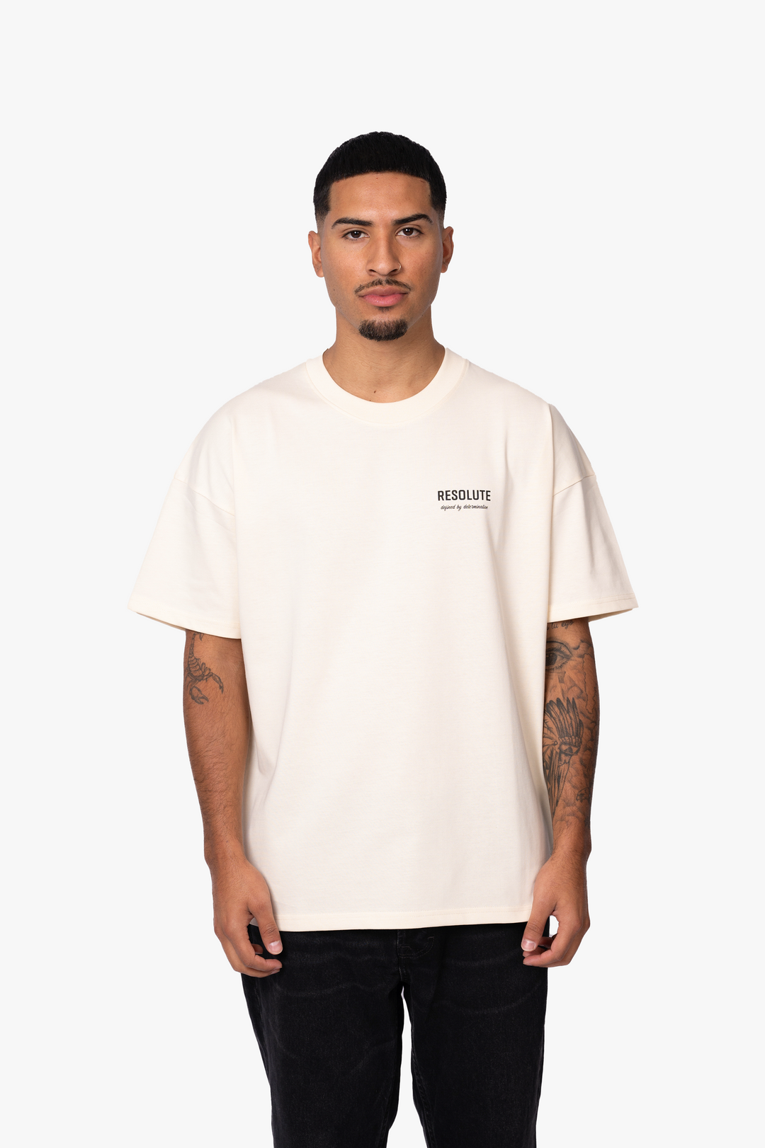 DEFINED BY DETERMINATION T-SHIRT | BEIGE