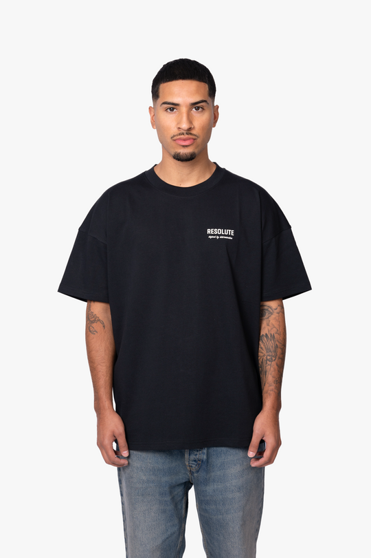 DEFINED BY DETERMINATION T-SHIRT | BLACK