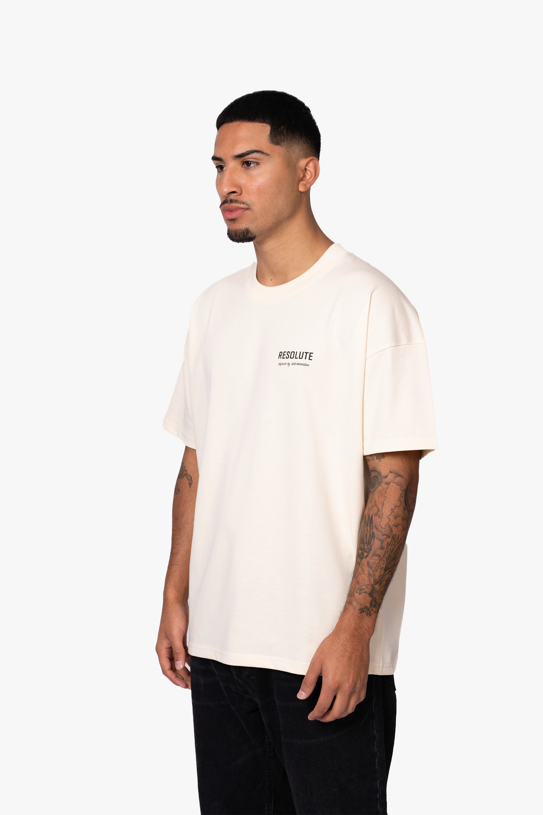 DEFINED BY DETERMINATION T-SHIRT | BEIGE