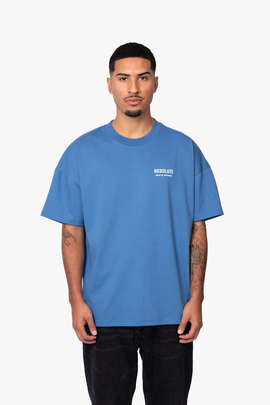 DEFINED BY DETERMINATION T-SHIRT | BLUE